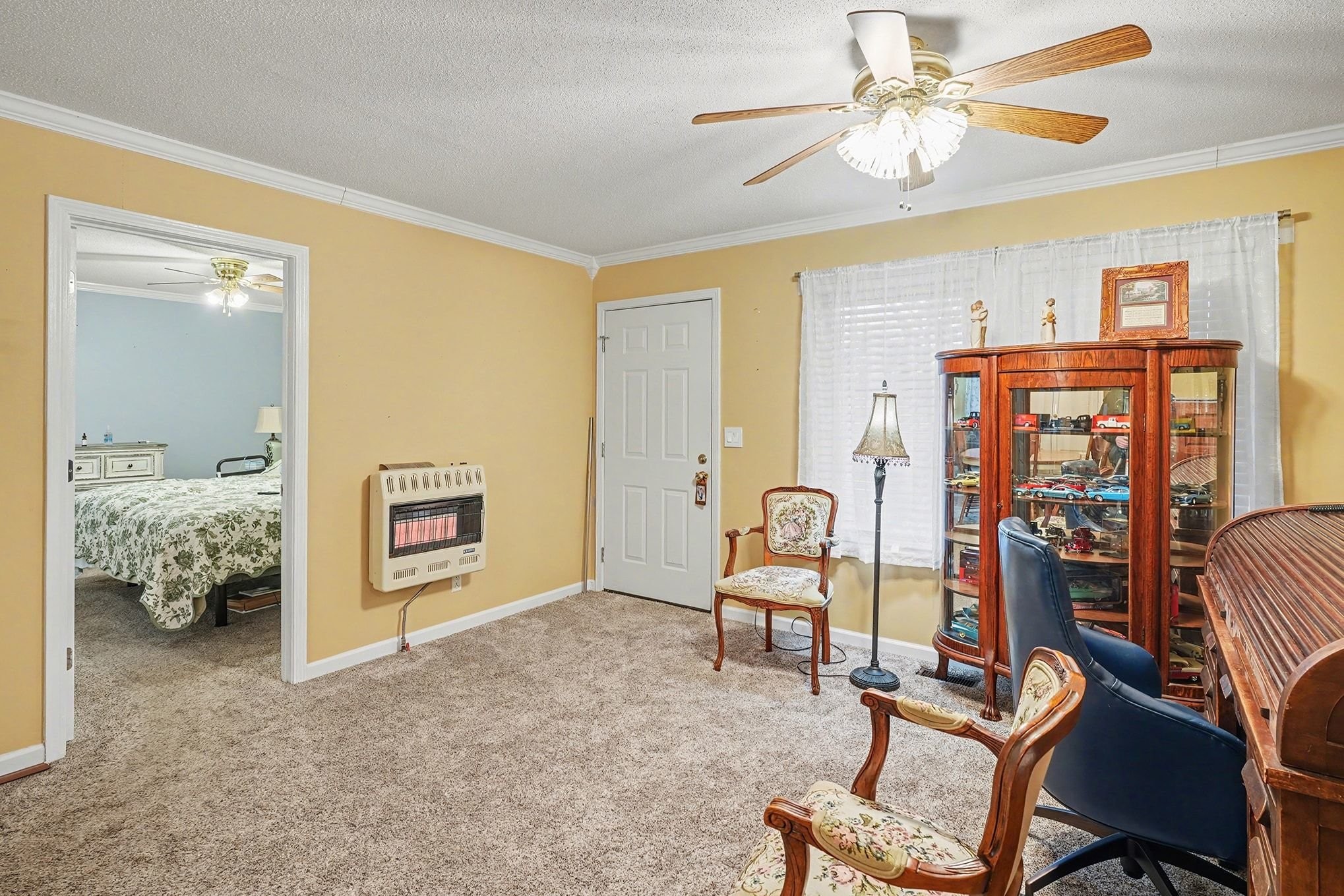 4918 Woodrow Road Woodlawn, TN 37191 - Photo 4 of 28 a living room with furniture and a chandelier