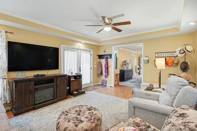 a living room with furniture and a flat screen tv