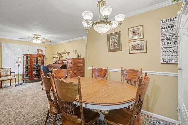 a view of a dining room with furniture