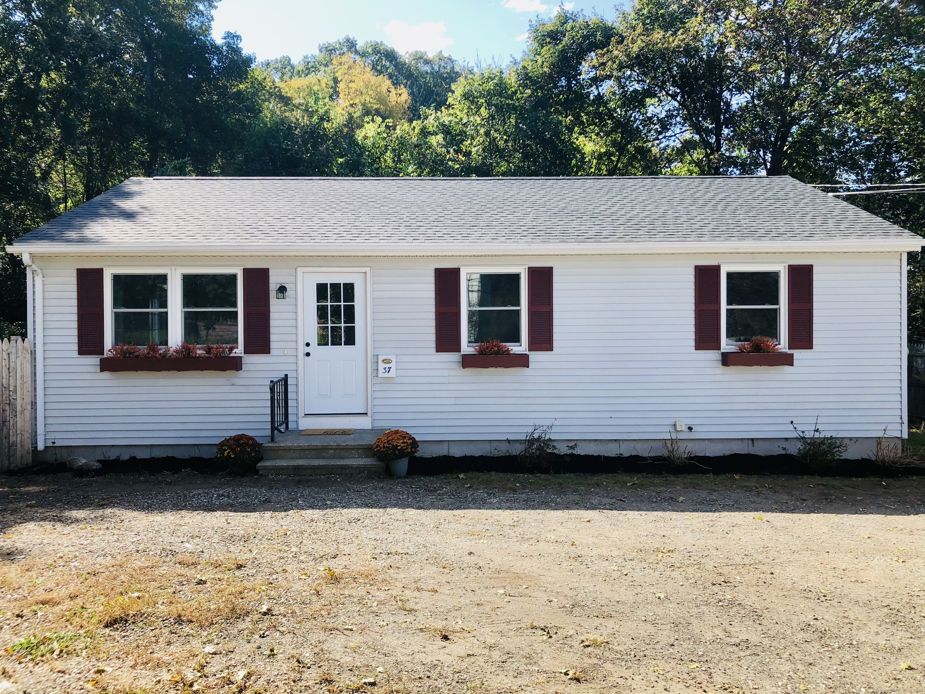 37 Walnut Street Putnam, CT 06260 - Photo 1 of 1 a view of a house with a large window