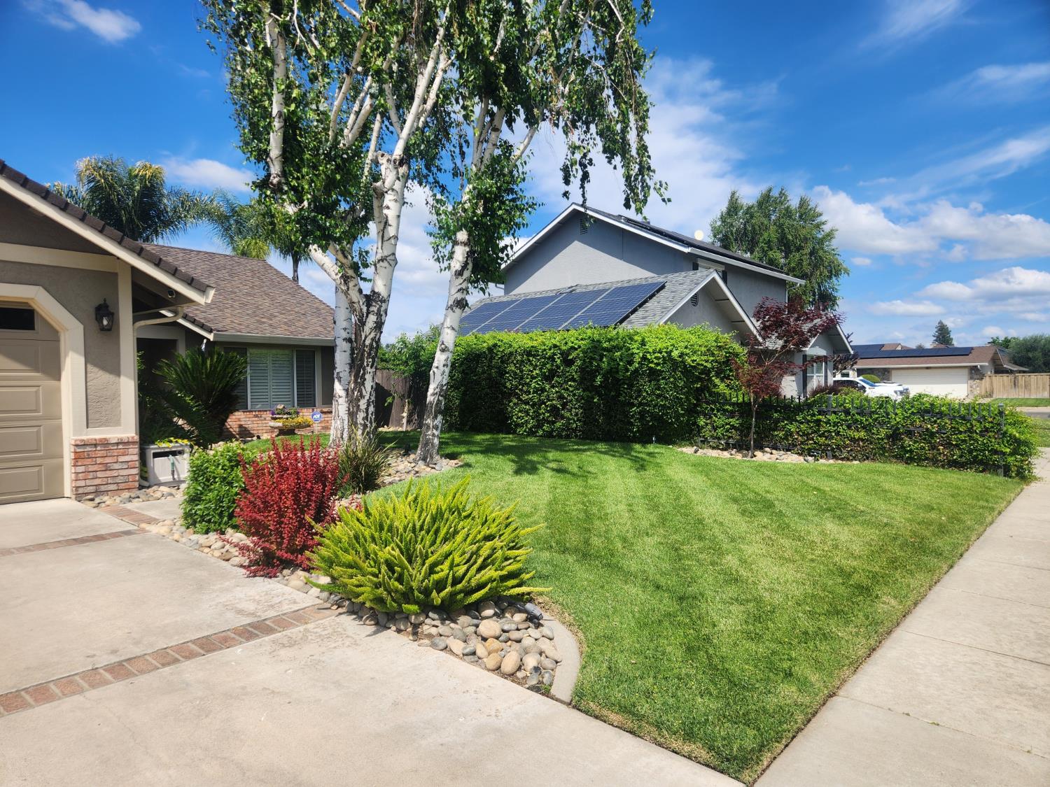 777 Jordanolo Drive Ripon, CA 95366 - Photo 5 of 61 a front view of a house with garden