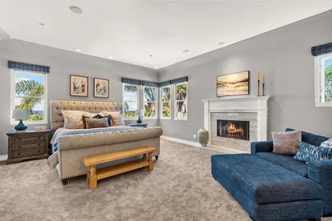 a bedroom with a bed and a fireplace