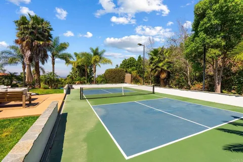 a view of a chairs and table in patio