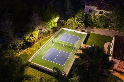 a view of a golf course with a swimming pool