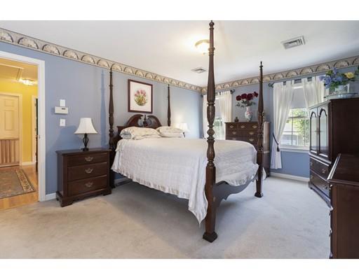35 Culloden Drive Canton, MA 02021 - Photo 16 of 31 a living room with a bed furniture and a flat screen tv