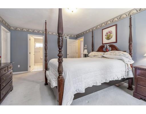 35 Culloden Drive Canton, MA 02021 - Photo 17 of 31 a spacious bedroom with a bed and dresser with mirror