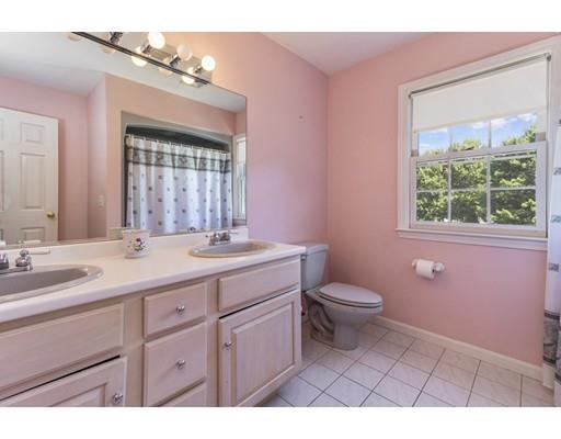 35 Culloden Drive Canton, MA 02021 - Photo 22 of 31 a bathroom with a sink a toilet a mirror a vanity and window