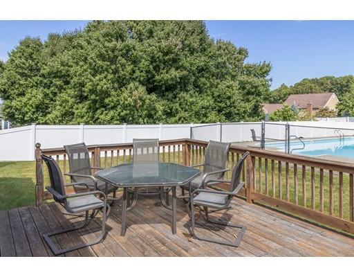35 Culloden Drive Canton, MA 02021 - Photo 24 of 31 a balcony with wooden floor table and chairs