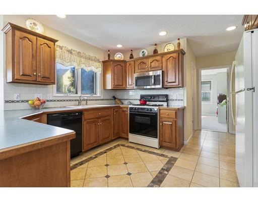 35 Culloden Drive Canton, MA 02021 - Photo 4 of 31 a kitchen with stainless steel appliances granite countertop a stove a sink dishwasher and a refrigerator