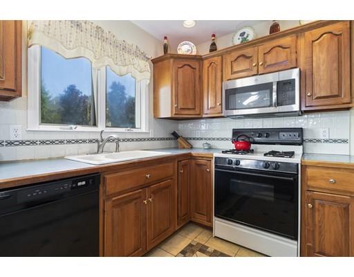 35 Culloden Drive Canton, MA 02021 - Photo 6 of 31 a kitchen with stainless steel appliances granite countertop a sink stove and microwave