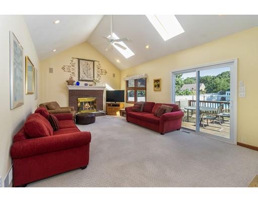 35 Culloden Drive Canton, MA 02021 - Photo 9 of 31 a living room with furniture a fireplace and a floor to ceiling window
