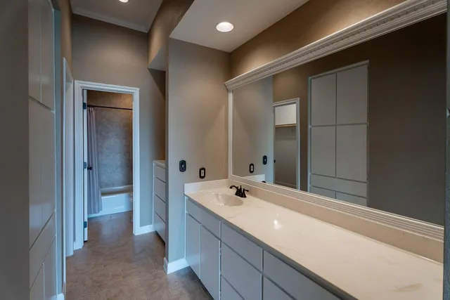 a bathroom with a bathtub and a sink