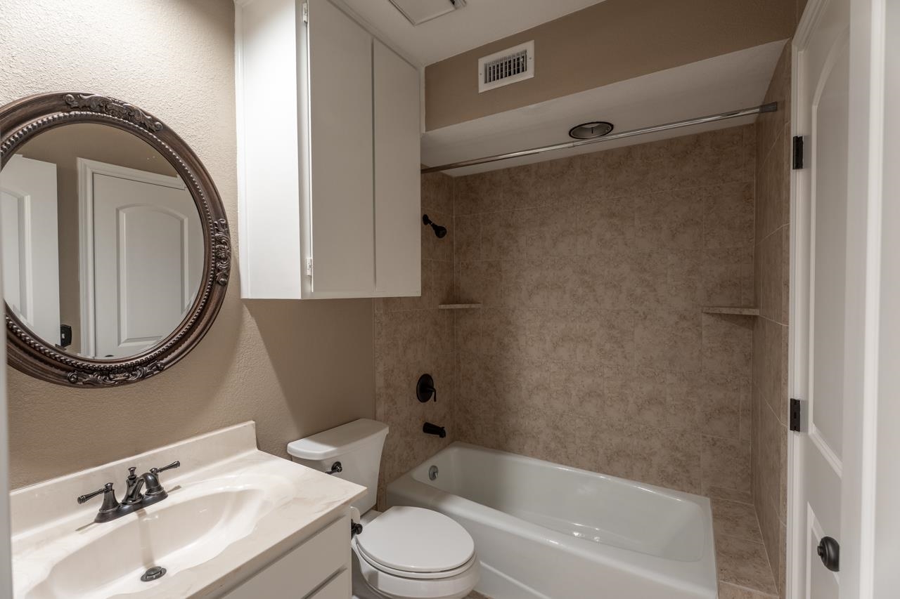 401 Hi There, Unit C Horseshoe Bay, TX 78657 - Photo 6 of 18 a bathroom with a sink toilet and shower