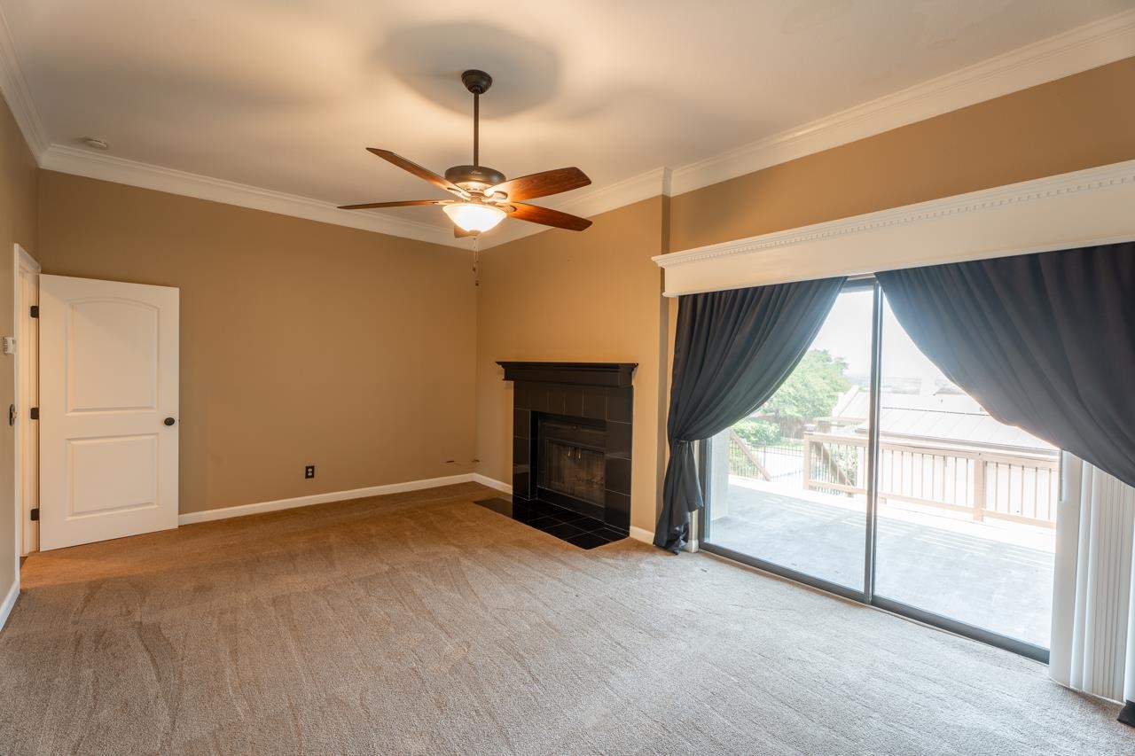 401 Hi There, Unit C Horseshoe Bay, TX 78657 - Photo 9 of 18 a view of an empty room with a fireplace and a window