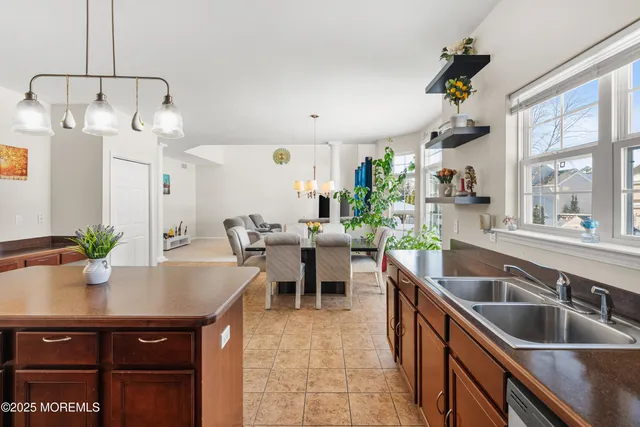 a kitchen with counter top space cabinets and stainless steel appliances