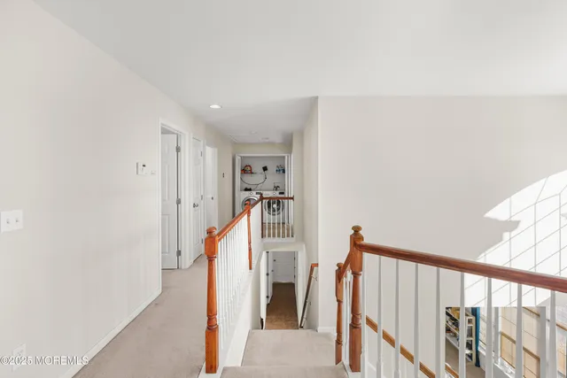 a view of a hallway with staircase