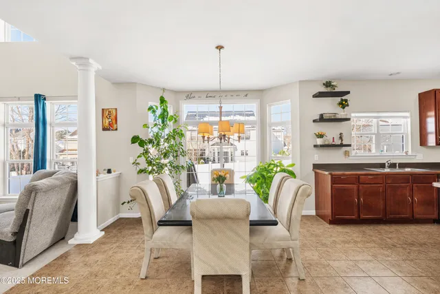 a dining room with furniture and window