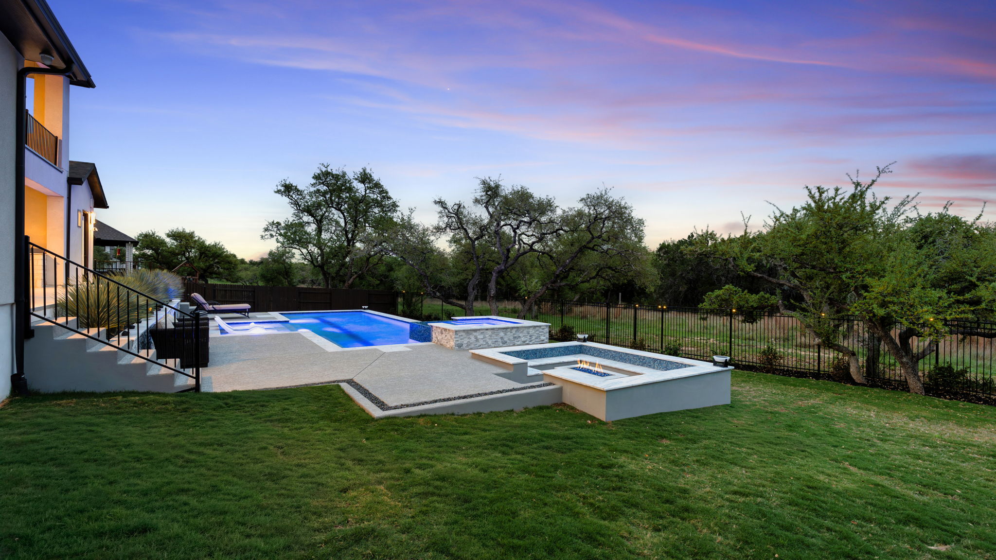 546 Bridge Water Loop Dripping Springs, TX 78620 - Photo 32 of 40 a view of backyard with trampoline