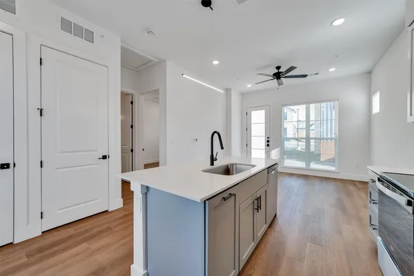 a kitchen that has a lot of cabinets in it