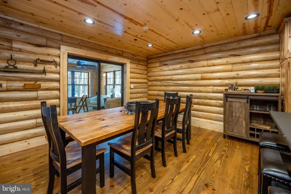 a large kitchen with a table and chairs in it
