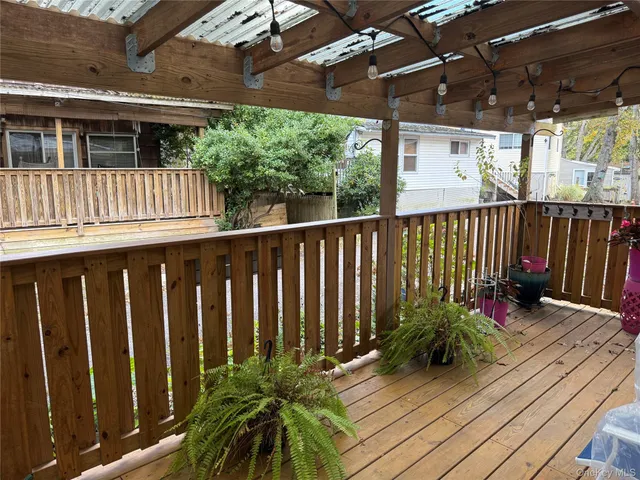 a view of porch with wooden floor