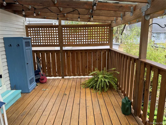 a balcony with wooden floor