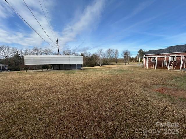 871 Bethany Church Road Forest City, NC 28043 - Photo 5 of 27 a view of a house with a yard
