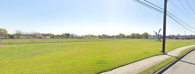 a view of a lake with a big yard
