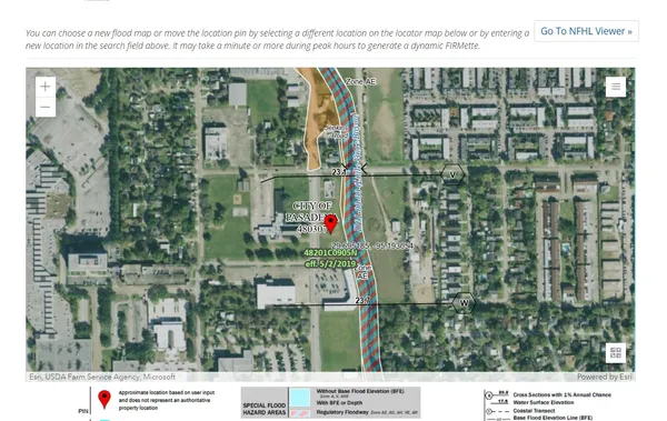 a view of a street with a building in the background