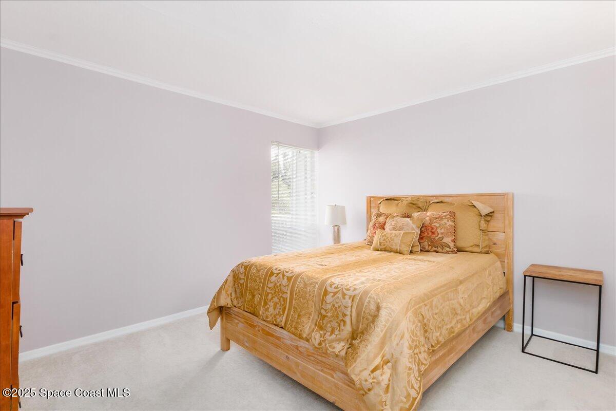 6124 River Run Drive Sebastian, FL 32958 - Photo 12 of 42 a bedroom with a bed and window