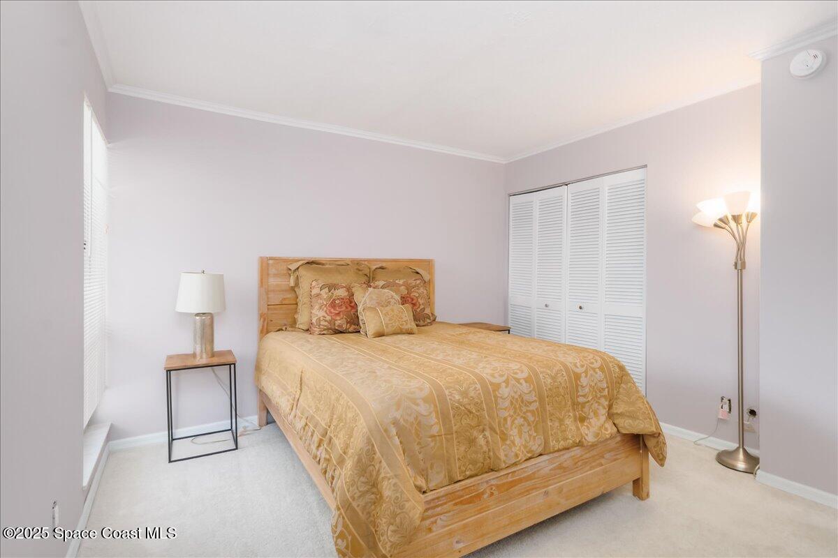 6124 River Run Drive Sebastian, FL 32958 - Photo 13 of 42 a bedroom with a bed and a night stand