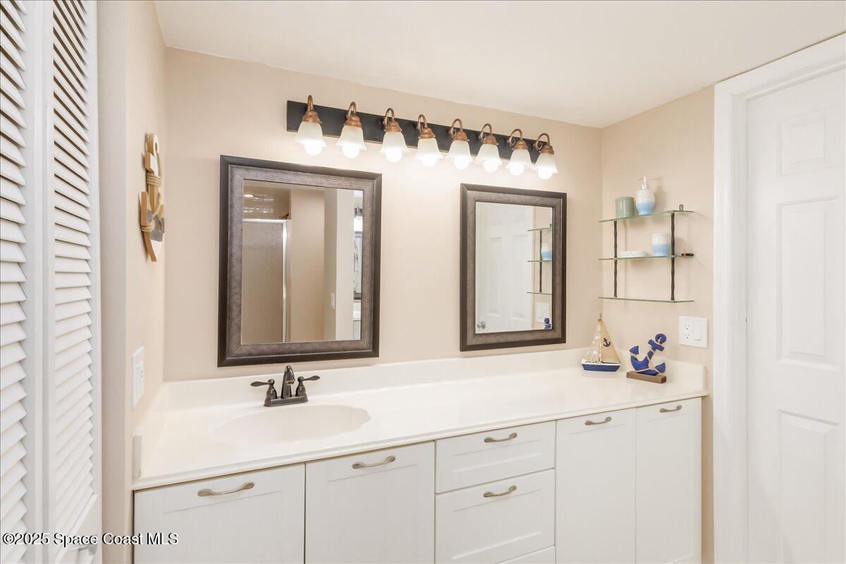 6124 River Run Drive Sebastian, FL 32958 - Photo 20 of 42 a bathroom with double sink and a mirror