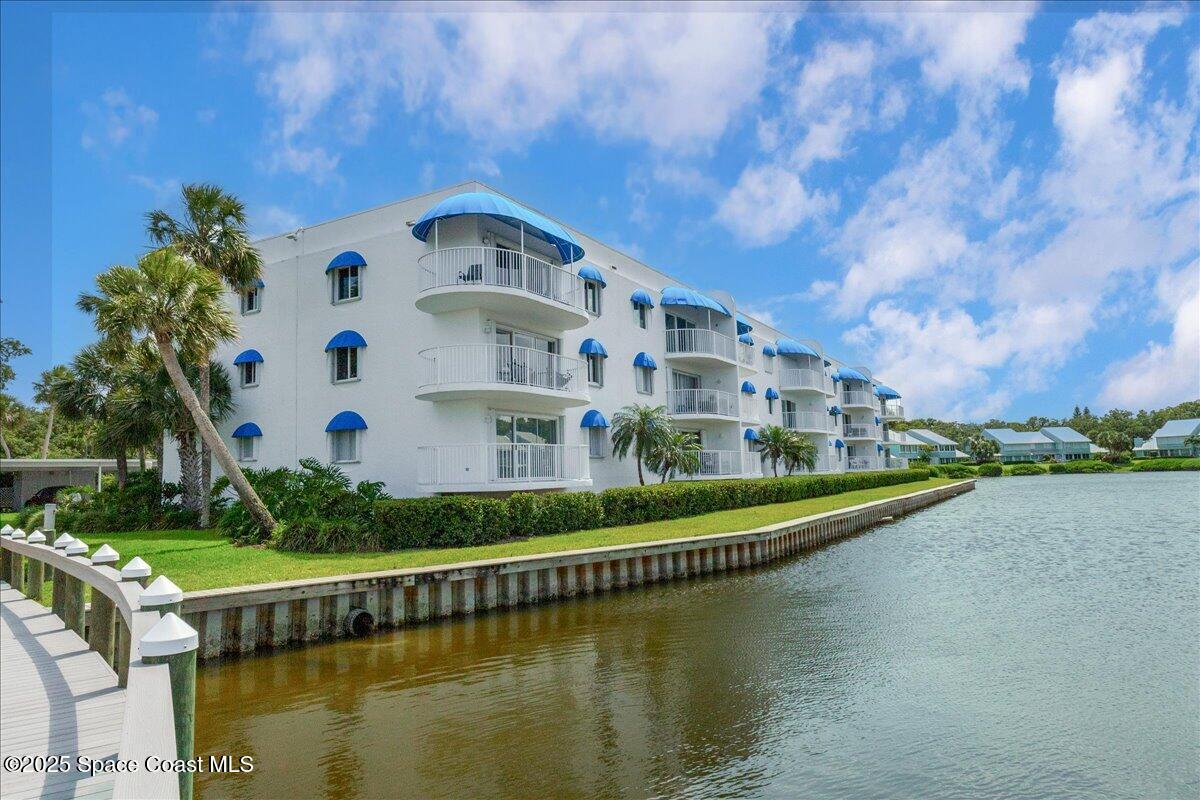 6124 River Run Drive Sebastian, FL 32958 - Photo 27 of 42 a view of a lake with a building in the background