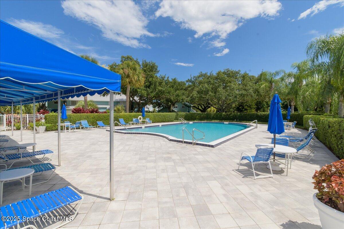 6124 River Run Drive Sebastian, FL 32958 - Photo 33 of 42 a view of a patio with a table and chairs under an umbrella