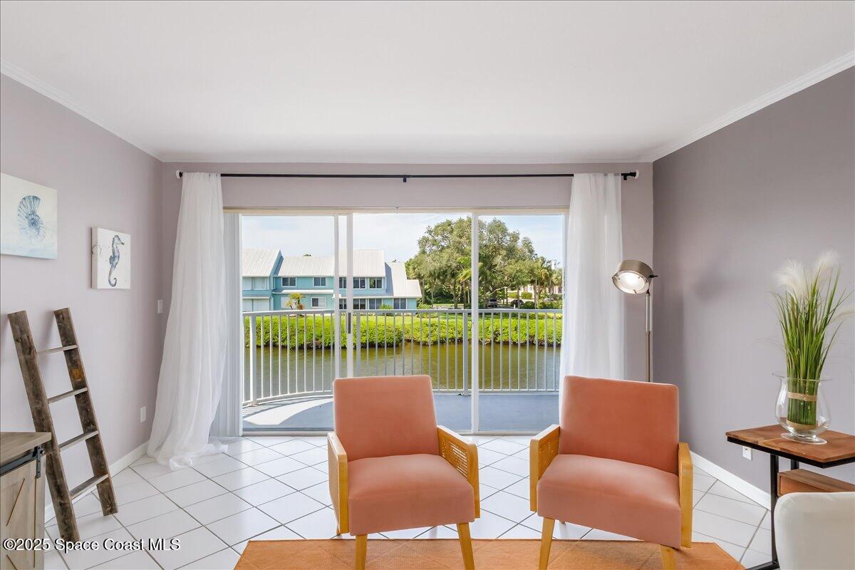 6124 River Run Drive Sebastian, FL 32958 - Photo 5 of 42 a living room with furniture and a floor to ceiling window