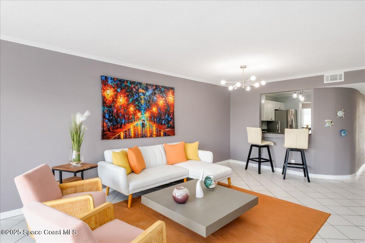 6124 River Run Drive Sebastian, FL 32958 - Photo 6 of 42 a living room with furniture a rug and a chandelier