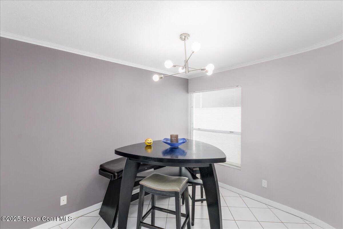 6124 River Run Drive Sebastian, FL 32958 - Photo 7 of 42 a view of a dining room with a table and chairs