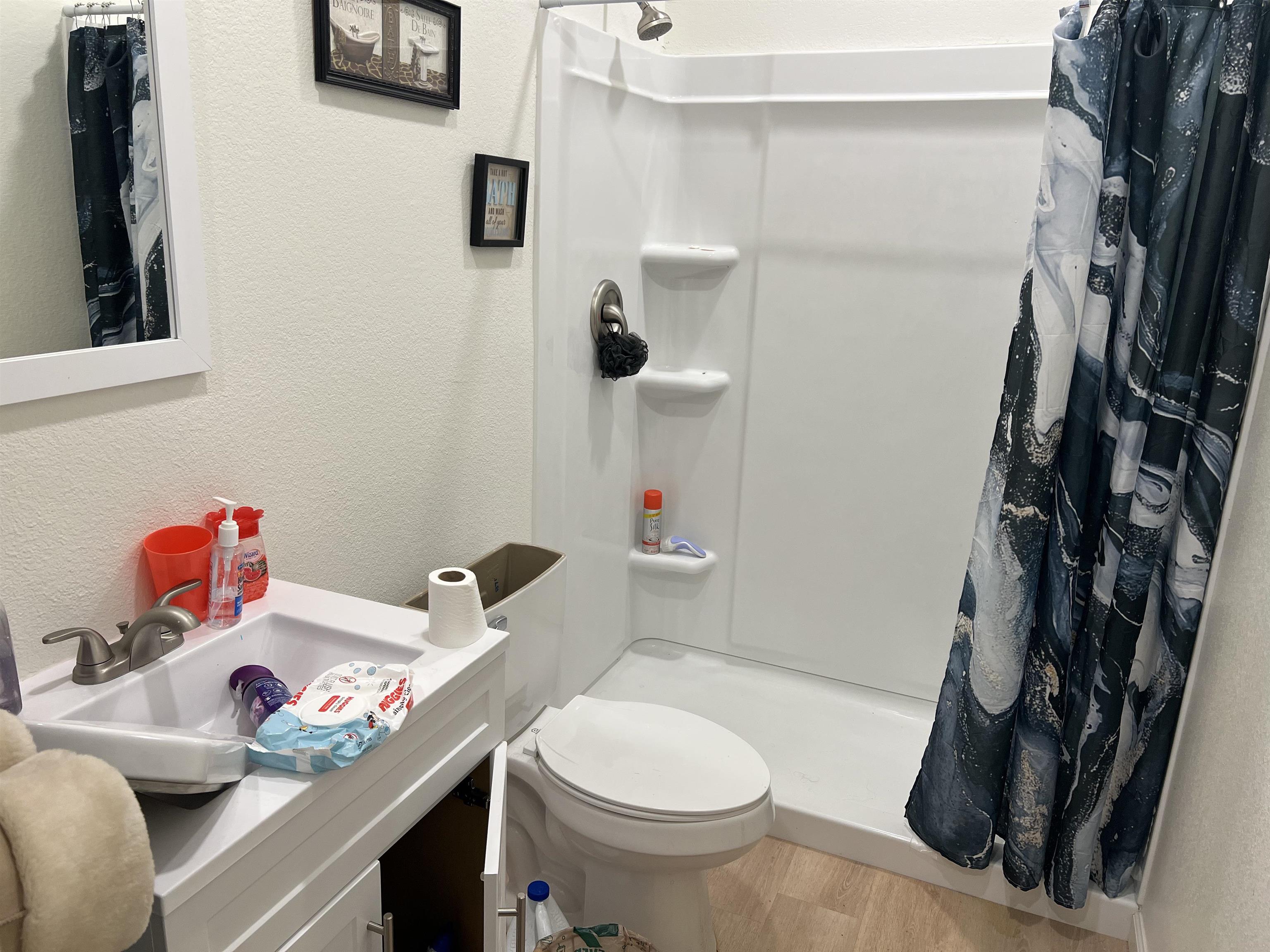 0 Ranch Road Kingsland, TX 78639 - Photo 14 of 20 a bathroom with a sink toilet and shower