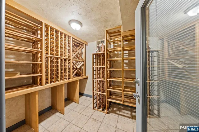 a view of a big room with refrigerator and a dresser