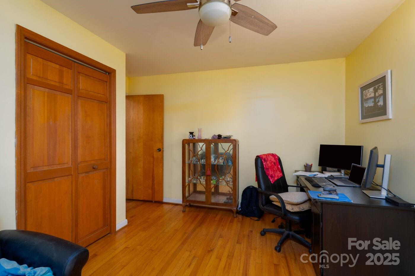 702 Rhodes Avenue Kings Mountain, NC 28086 - Photo 13 of 17 a view of a workspace with furniture and wooden floor