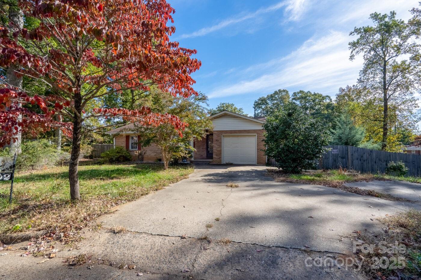 702 Rhodes Avenue Kings Mountain, NC 28086 - Photo 3 of 17 a view of a yard with a house in the background