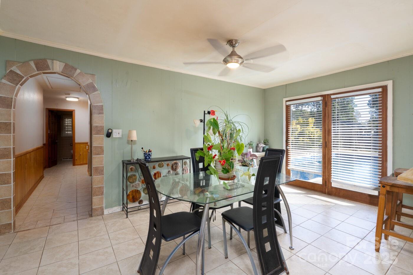 702 Rhodes Avenue Kings Mountain, NC 28086 - Photo 7 of 17 a view of a dining room with furniture and a chandelier