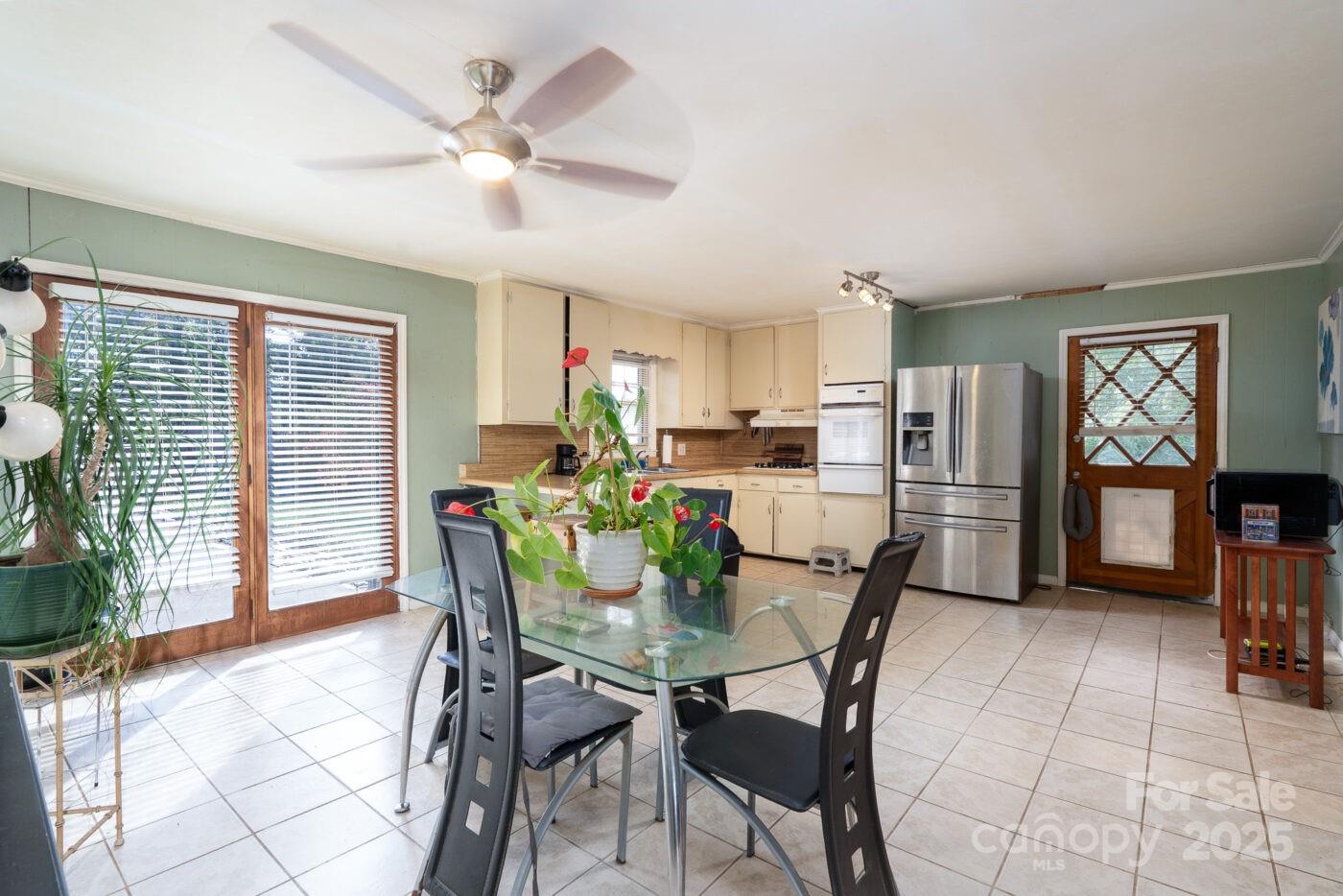 702 Rhodes Avenue Kings Mountain, NC 28086 - Photo 8 of 17 a view of a dining room with furniture and a large window