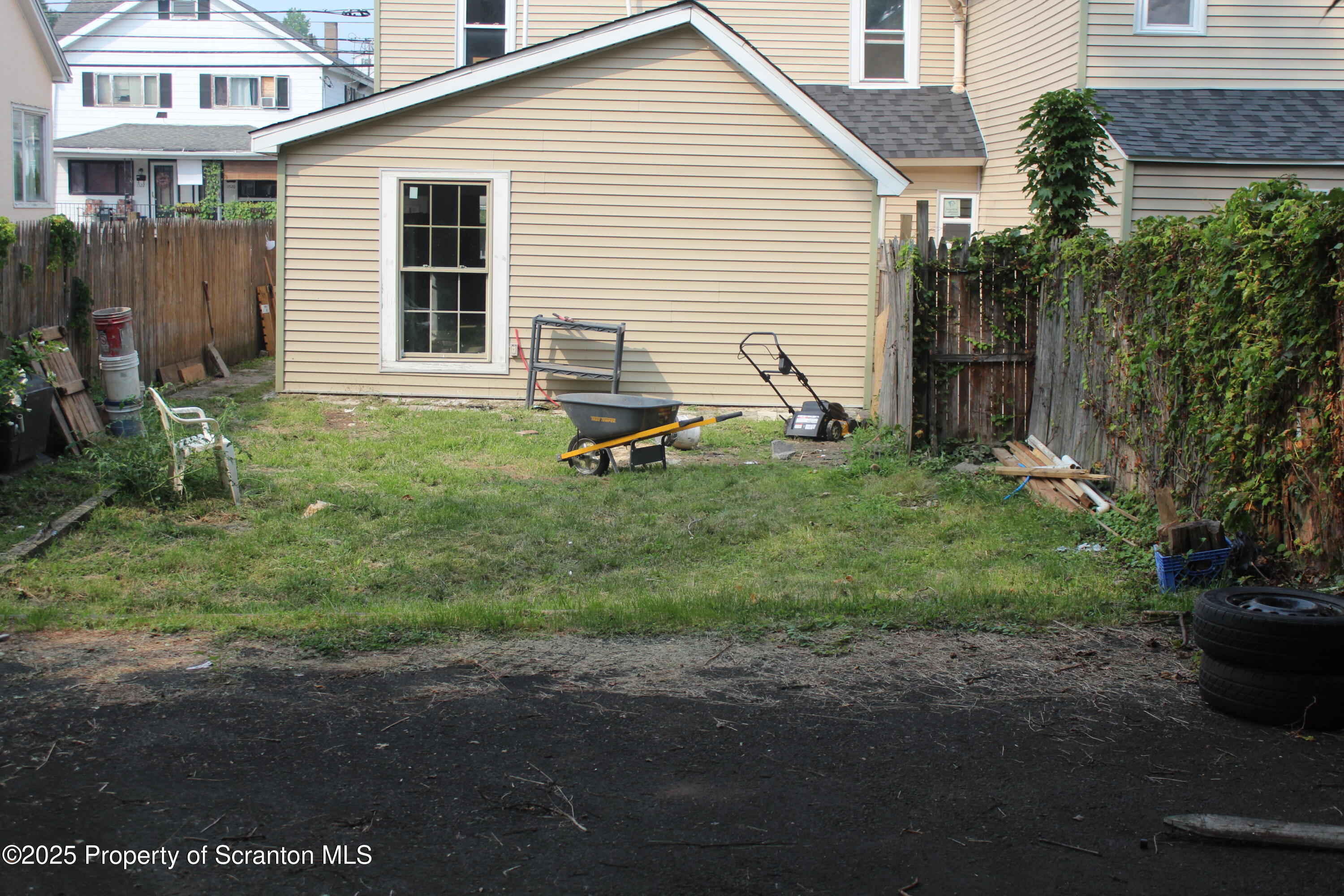 1507 Luzerne Street Scranton, PA 18504 - Photo 26 of 26 a backyard of a house with plants and outdoor seating