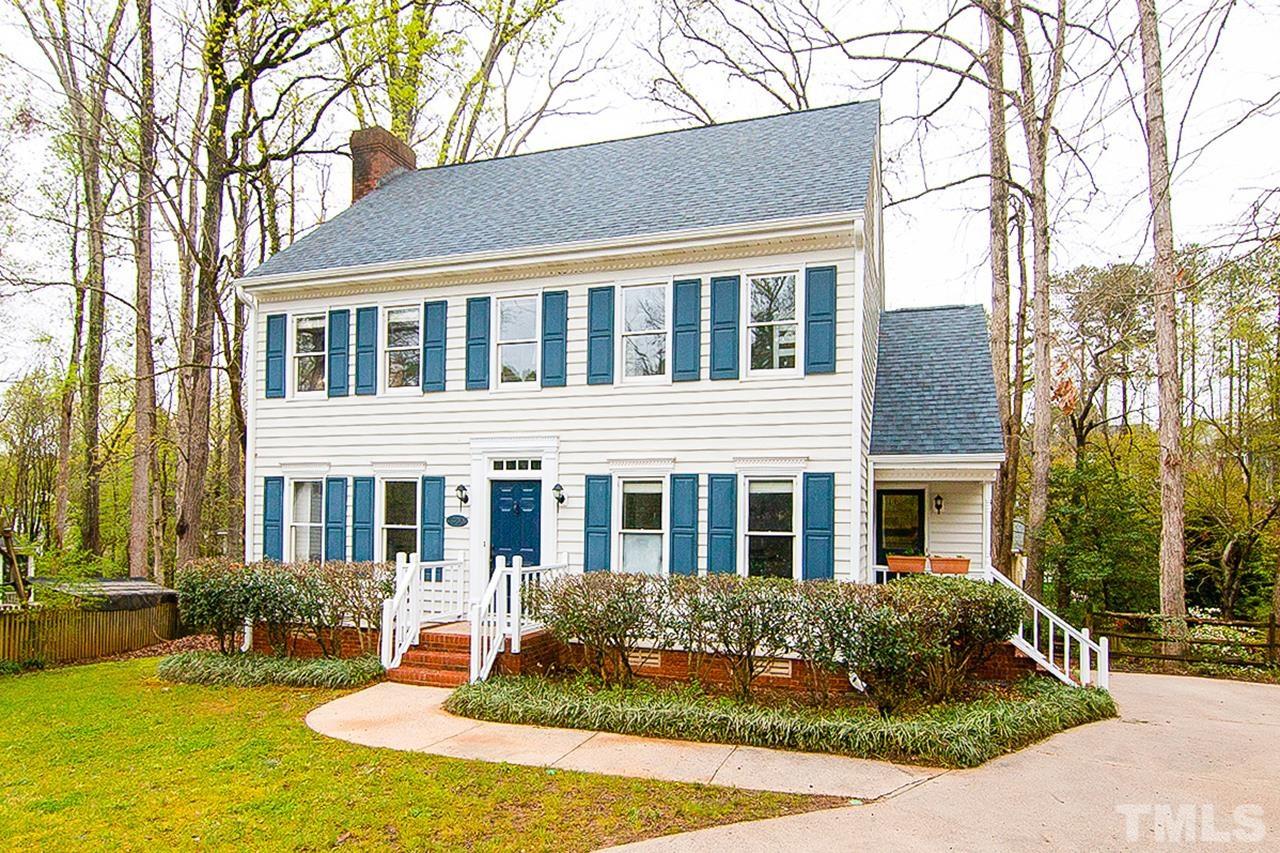 7300 Quinby Court Raleigh, NC 27613 - Photo 1 of 29 a front view of a house with yard and green space