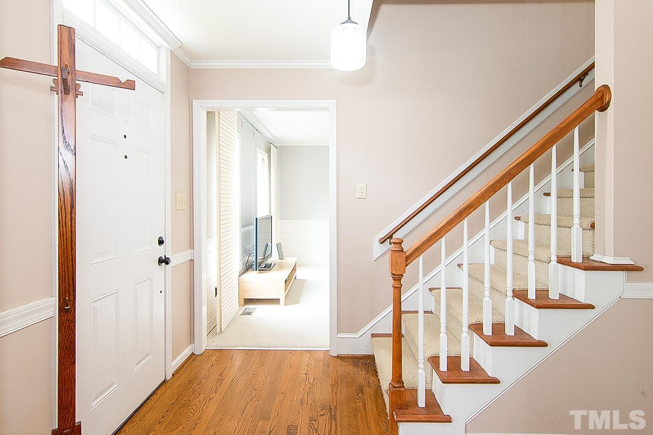 7300 Quinby Court Raleigh, NC 27613 - Photo 14 of 29 a view of staircase with wooden floor and staircase