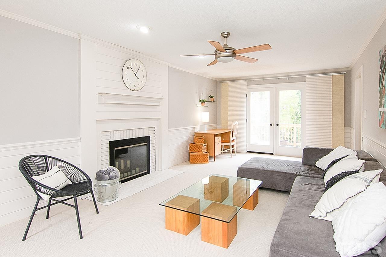 7300 Quinby Court Raleigh, NC 27613 - Photo 7 of 29 a living room with furniture and a fireplace