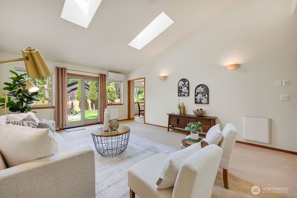 4919 Bell Street Port Townsend, WA 98368 - Photo 11 of 40 a living room with furniture and a large window