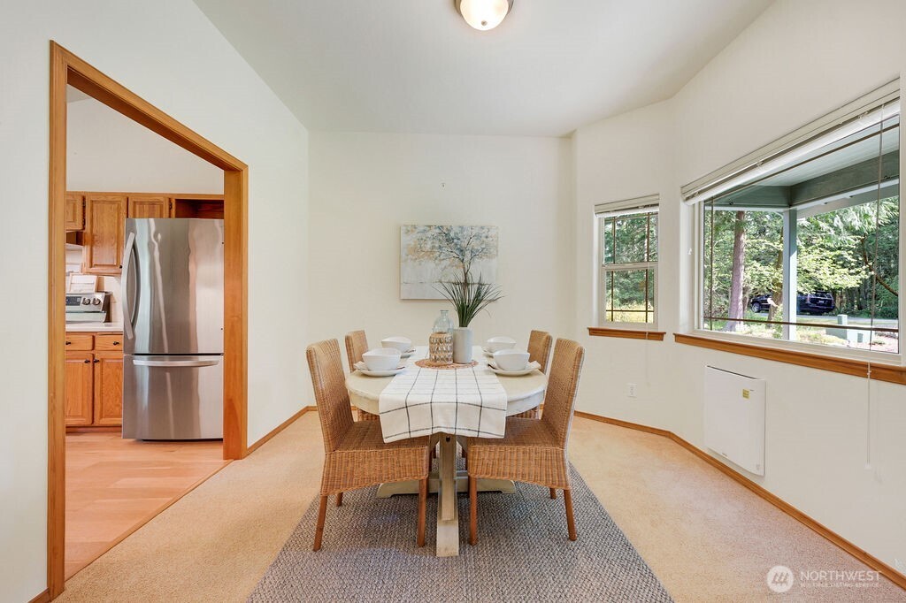 4919 Bell Street Port Townsend, WA 98368 - Photo 14 of 40 a view of a dining room with furniture window and outside view