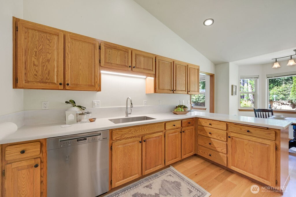 4919 Bell Street Port Townsend, WA 98368 - Photo 17 of 40 a kitchen with a sink and cabinets